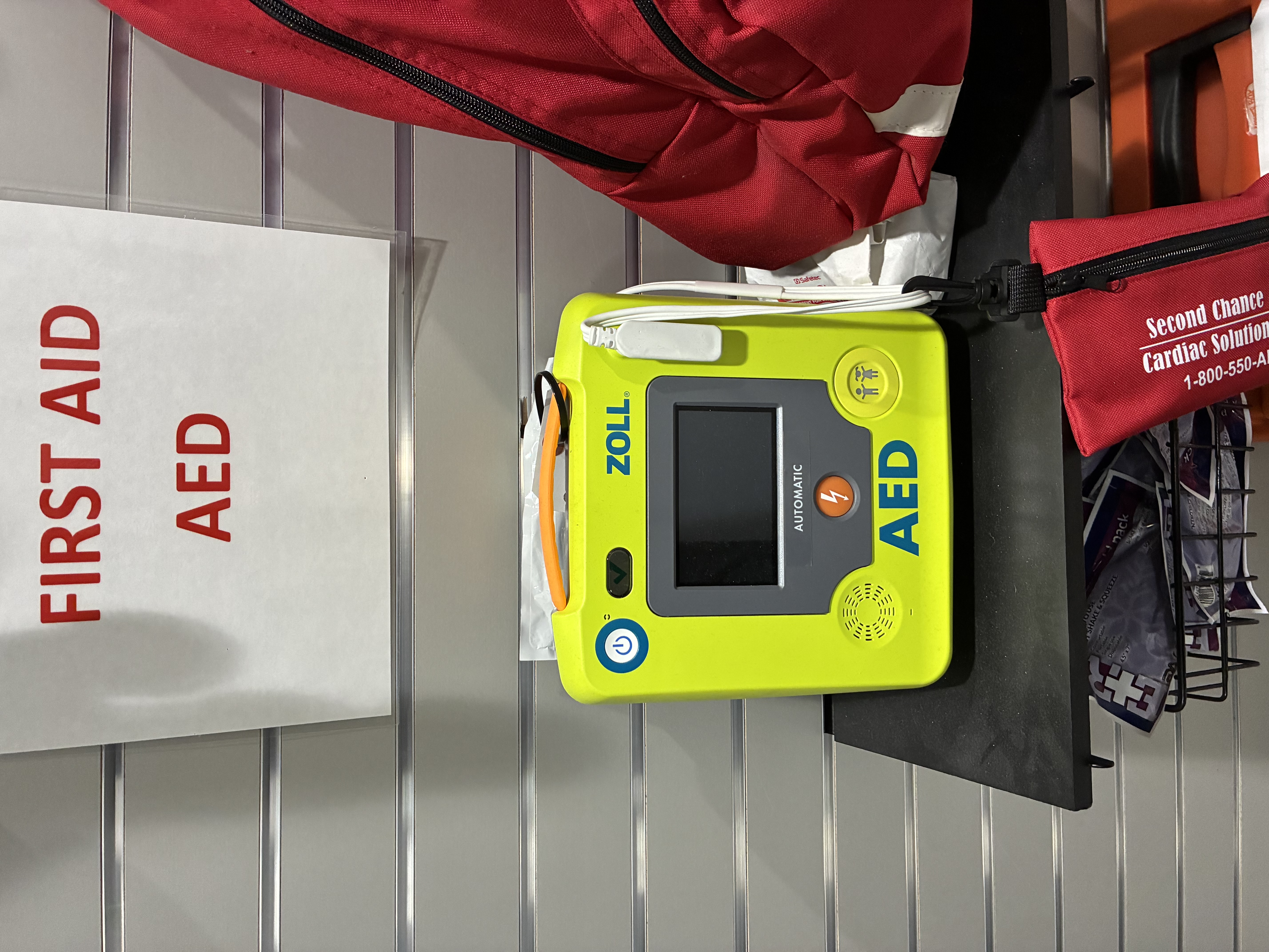 Tennis Center front desk AED location