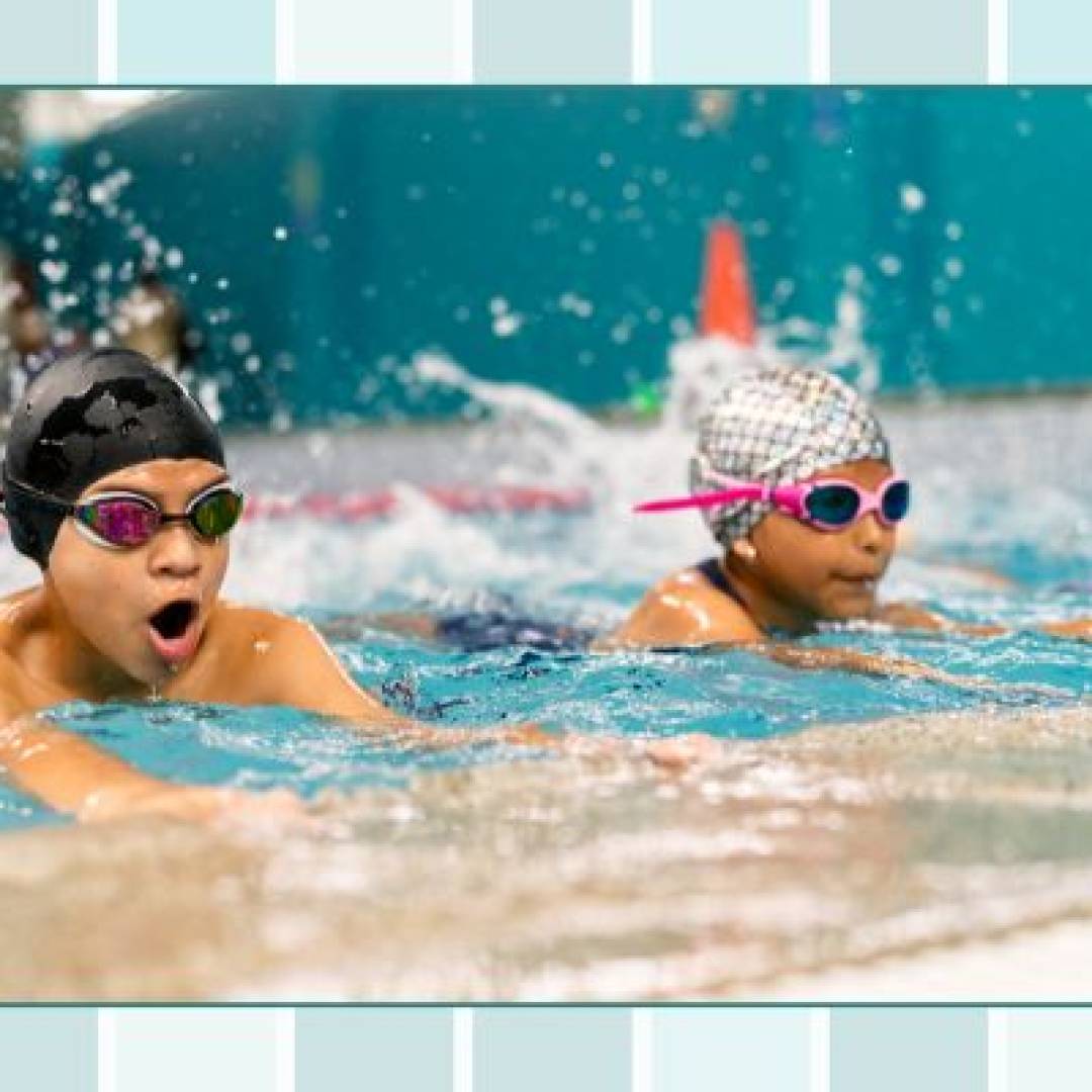 Children and a baby participating in swim lessons, practicing water skills and learning to swim with instructor support.